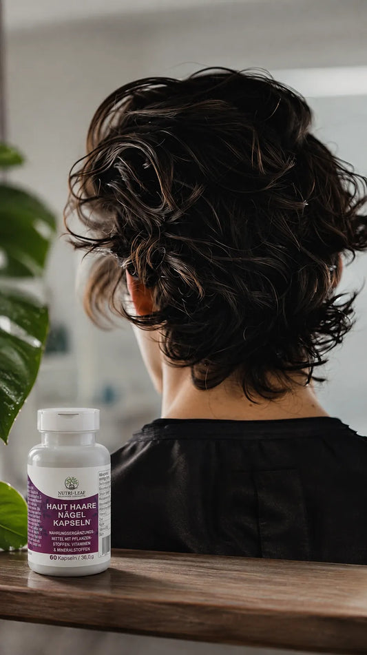 Stylish wavy hair scene with Nutri-Leaf Skin, Hair and Nails capsules.